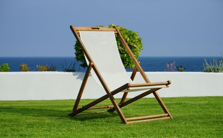 Turf Showing Chair with Beach Background